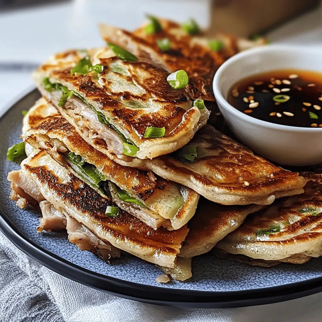 These Spring Onion Pancakes filled with juicy sticky pork are a delightful treat! The crispy exterior paired with a rich soy chili dipping sauce creates a perfect balance of flavors. Ideal for a family dinner or as an appetizer for gatherings, these pancakes will impress everyone at your table. Save this recipe for your next culinary adventure!