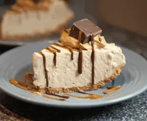 Delicious no-bake peanut butter pie topped with whipped cream and chocolate shavings
