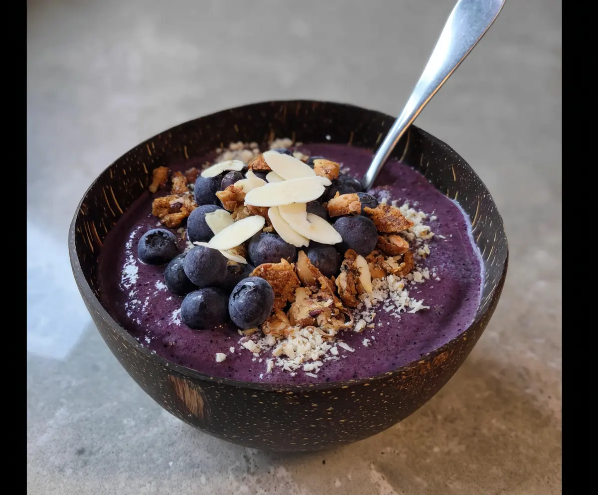 Healthy Blueberry Bliss Smoothie Bowl topped with fresh berries and granola