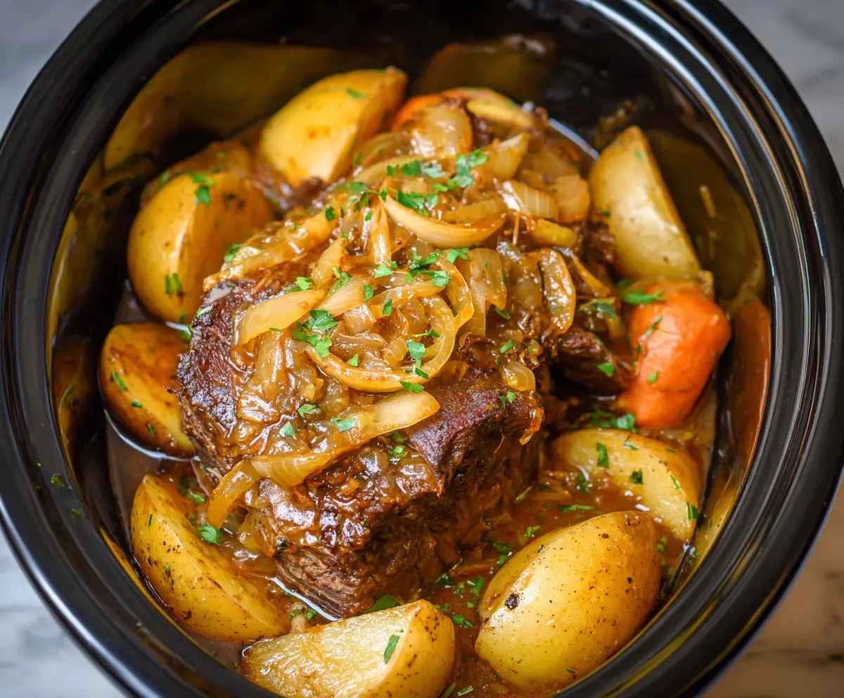 Delicious Crockpot French Onion Pot Roast with caramelized onions and tender beef served in a slow cooker.
