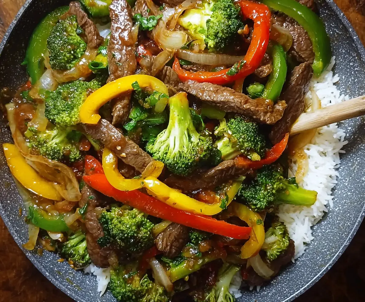 Delicious easy beef stir fry with colorful vegetables in a pan, perfect for a quick dinner recipe.