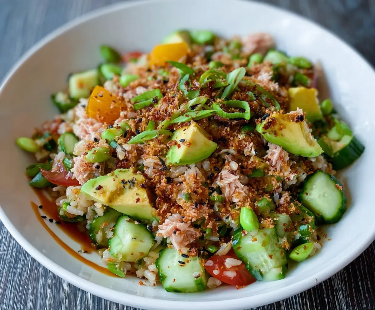 Fresh Tuna Avocado Crispy Rice Salad in a bowl, featuring vibrant ingredients and crunchy rice texture.