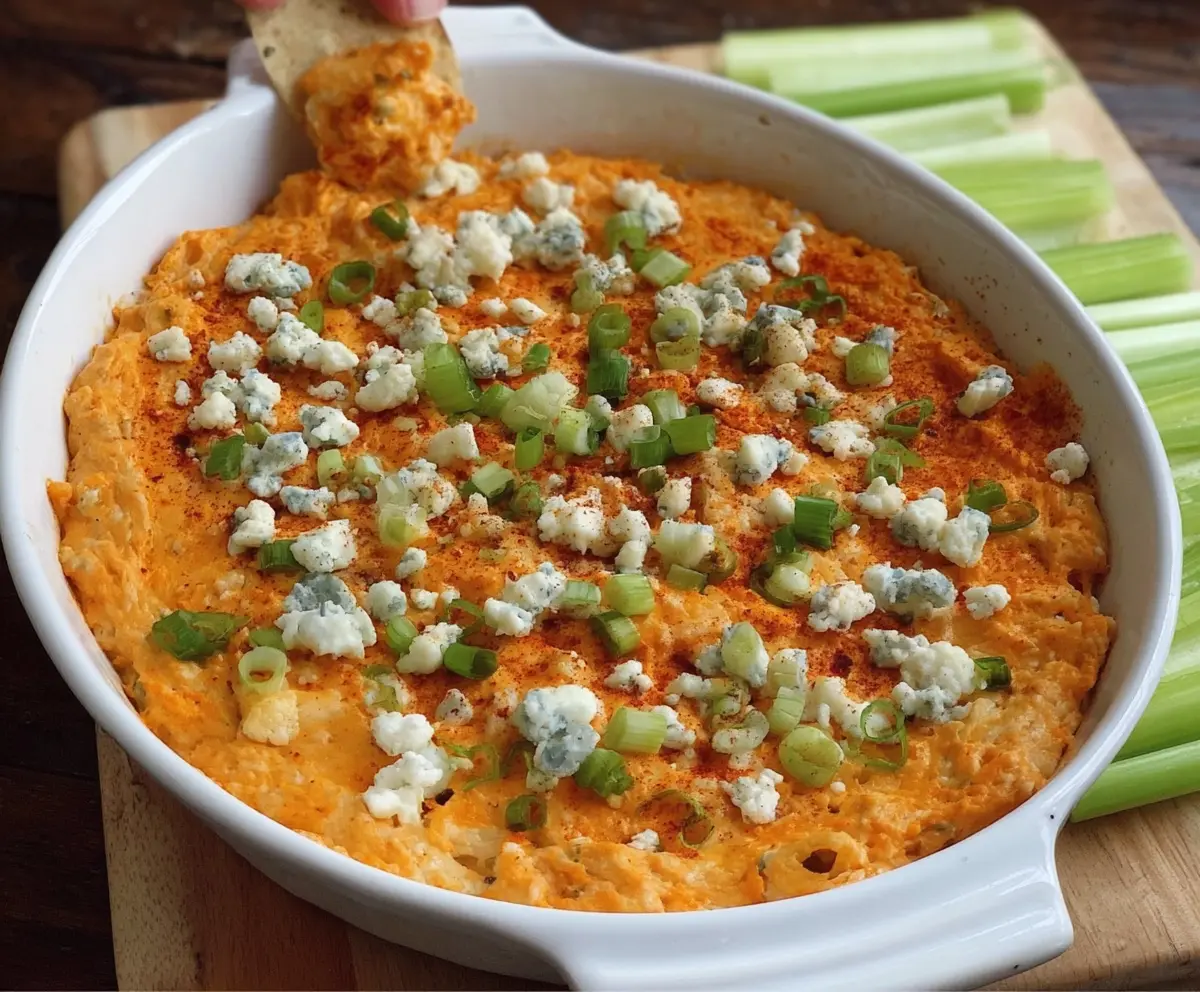 Creamy Buffalo Cauliflower Dip with spicy buffalo sauce and fresh herbs