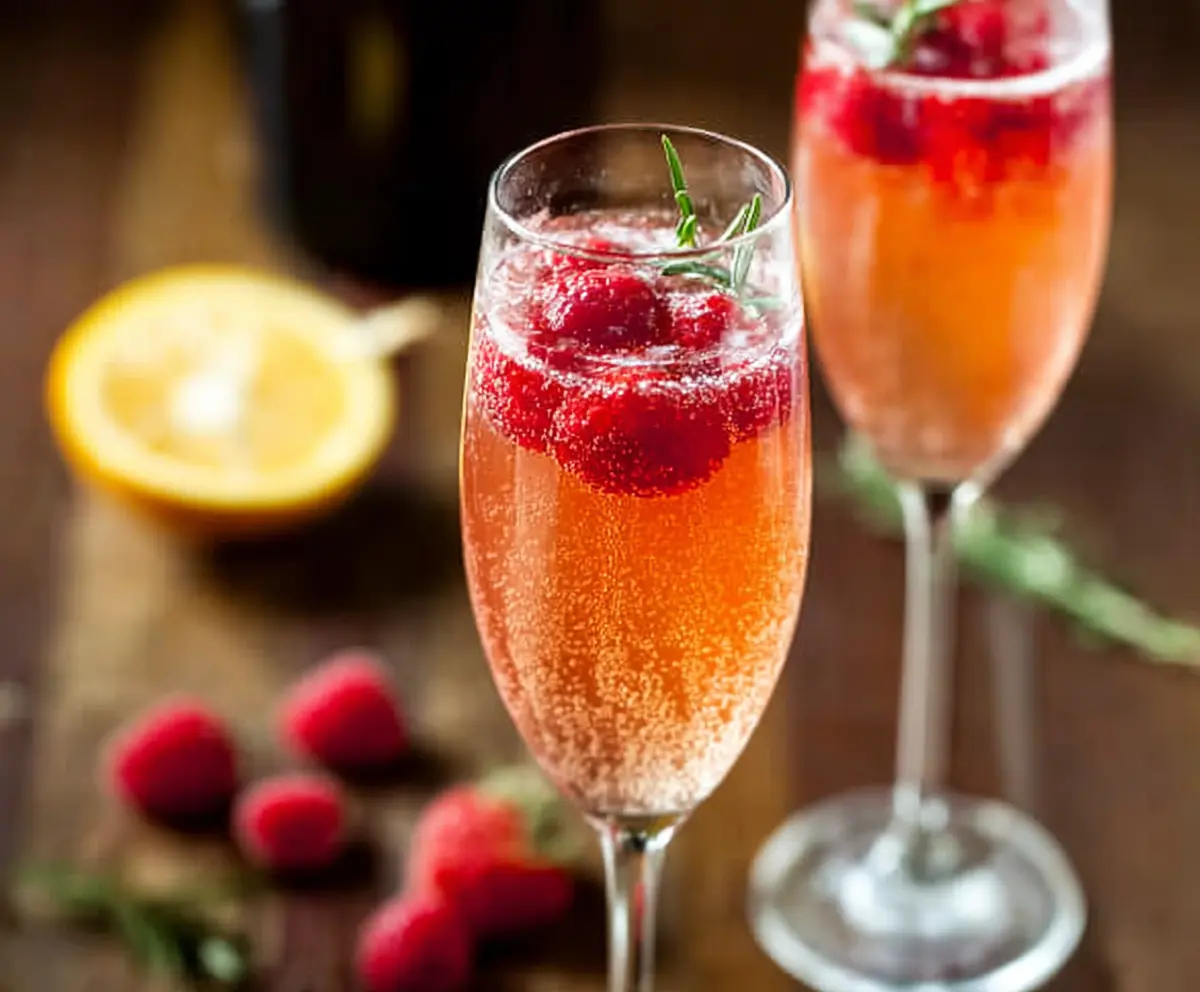 Refreshing Champagne Punch Bellini served in a elegant glass with citrus garnishes for a festive celebration.