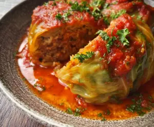 Delicious classic stuffed cabbage rolls with savory filling on a plate.