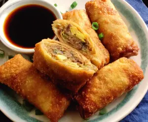 Crispy and golden authentic Chinese egg rolls filled with seasoned vegetables and meat.