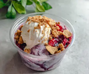 Delicious Berry Crumble Ice Cream with fresh berries and crunchy crumble topping