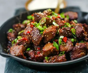 Delicious Korean Steak Bites served on a plate with garnishes, perfect for a flavorful appetizer or snack.