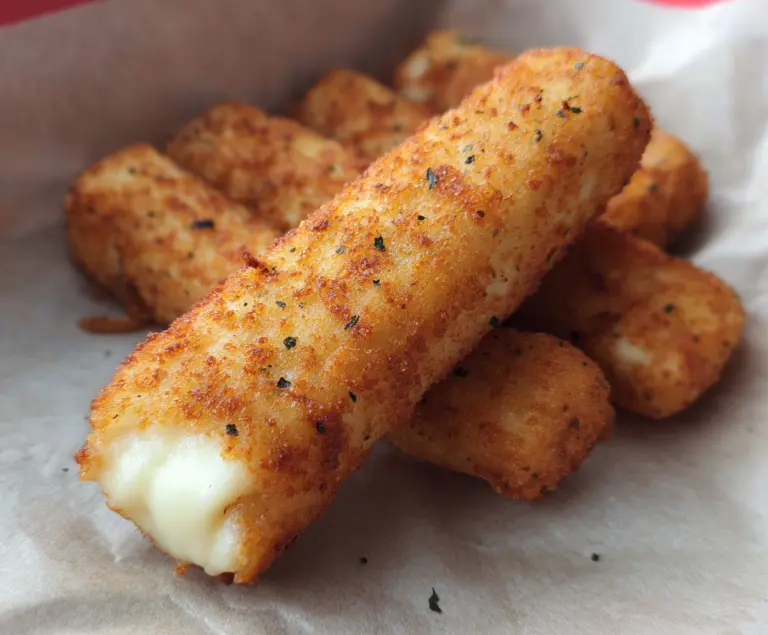 Golden mozzarella sticks with crispy breadcrumb coating, perfect for snacks and appetizers.