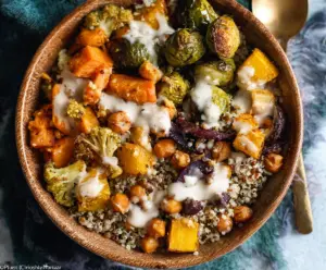 Colorful roasted vegetable quinoa bowl with fresh herbs, healthy and vibrant meal option